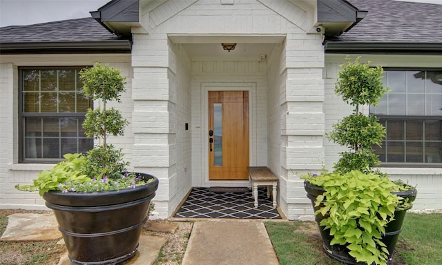 13417 Hickory Creek Dr, Haslet, TX 76052 - property entrance with roof with shingles and brick siding