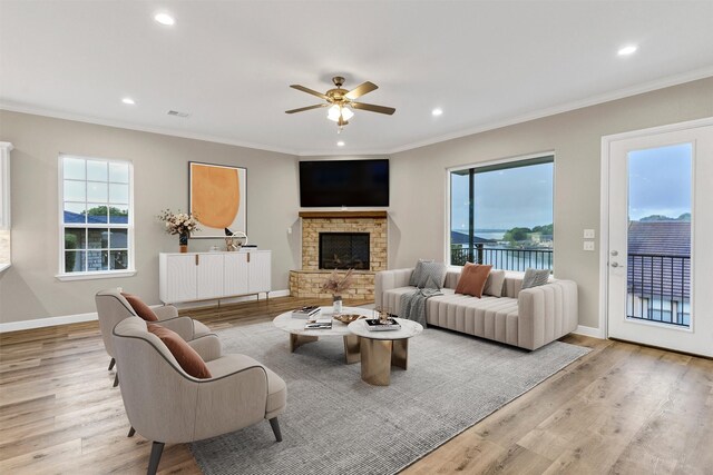 5128 Country Club Dr, Granbury, TX 76049 - living room with wood finished floors, a fireplace, a ceiling fan, crown molding, and recessed lighting