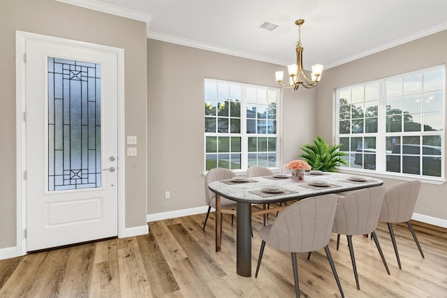 5128 Country Club Dr, Granbury, TX 76049 - dining space with a chandelier, light wood-style floors, baseboards, healthy amount of natural light, and crown molding