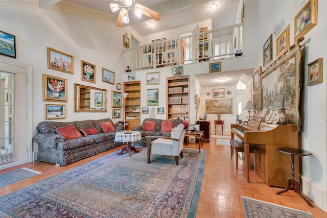 1412 Hyde Park Ln, Arlington, TX 76015 - living room with ceiling fan, baseboards, crown molding, and a high ceiling