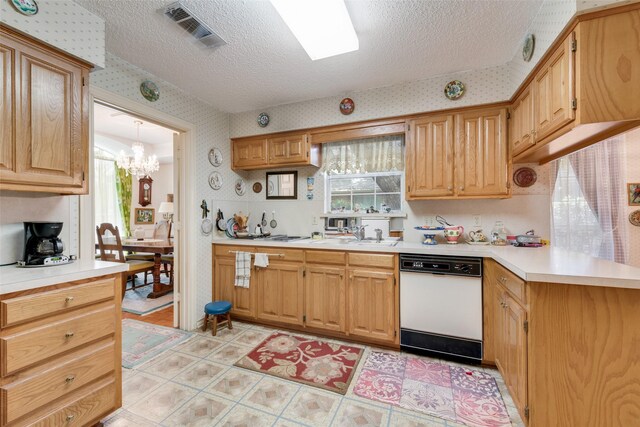 1412 Hyde Park Ln, Arlington, TX 76015 - kitchen with dishwasher, wallpapered walls, a textured ceiling, light countertops, and a chandelier