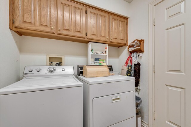1412 Hyde Park Ln, Arlington, TX 76015 - laundry area with washer and clothes dryer and cabinet space