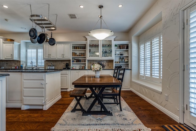 9808 Capilano Dr, Plano, TX 75025 - kitchen featuring open shelves, plenty of natural light, recessed lighting, and dark wood-style floors