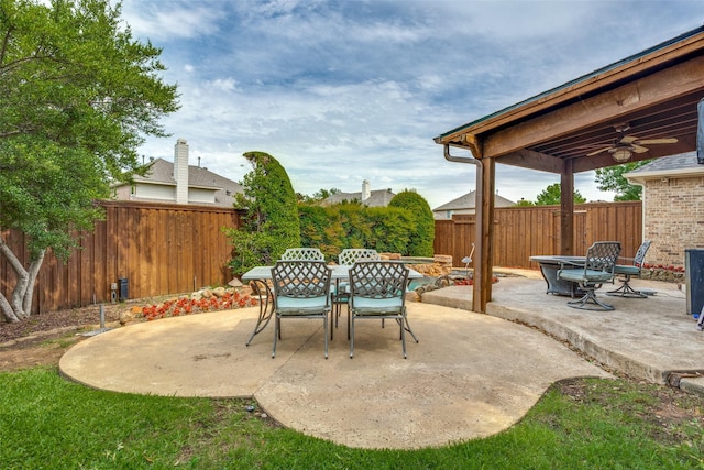 9808 Capilano Dr, Plano, TX 75025 - fenced backyard with a patio area, ceiling fan, and outdoor dining area
