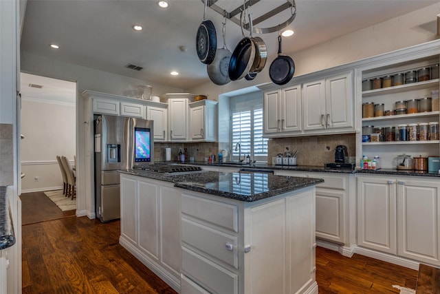 9808 Capilano Dr, Plano, TX 75025 - kitchen with stainless steel appliances, a center island, a sink, backsplash, and recessed lighting