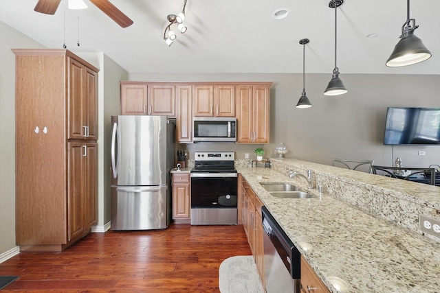 575 S Virginia Hills Dr Unit 3702, Mckinney, TX 75070 - kitchen with appliances with stainless steel finishes, a sink, a ceiling fan, light stone countertops, and dark wood-type flooring