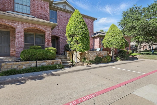 575 S Virginia Hills Dr Unit 3702, Mckinney, TX 75070 - view of front of property featuring brick siding and uncovered parking