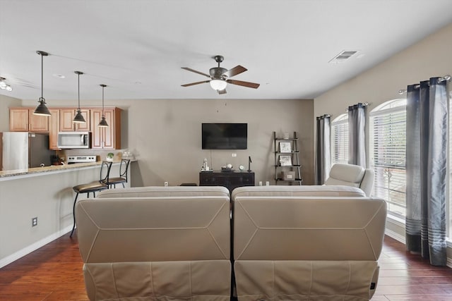 575 S Virginia Hills Dr Unit 3702, Mckinney, TX 75070 - living room featuring a ceiling fan, dark wood-style floors, and baseboards
