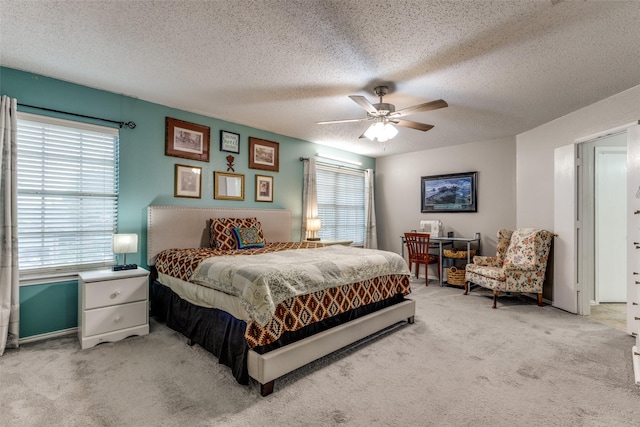 1017 Lake Trail Dr, Little Elm, TX 75068 - bedroom with light carpet, a textured ceiling, ceiling fan, and baseboards