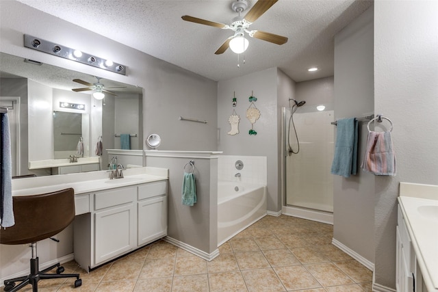 1017 Lake Trail Dr, Little Elm, TX 75068 - bathroom featuring ceiling fan, vanity, a bath, a shower stall, and a textured ceiling