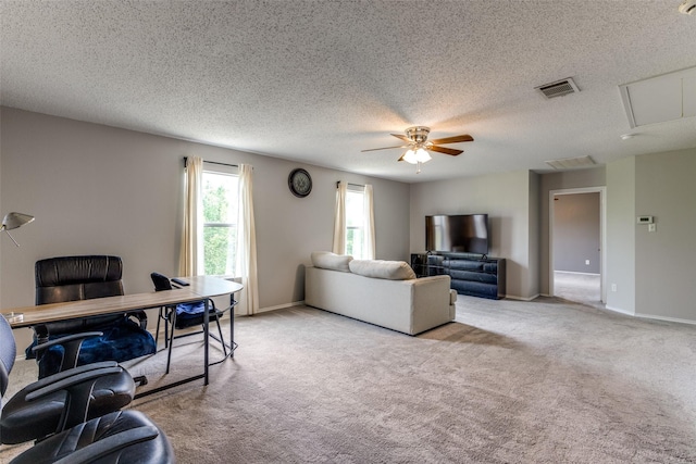 1017 Lake Trail Dr, Little Elm, TX 75068 - carpeted living area featuring a ceiling fan, a textured ceiling, baseboards, and an office area