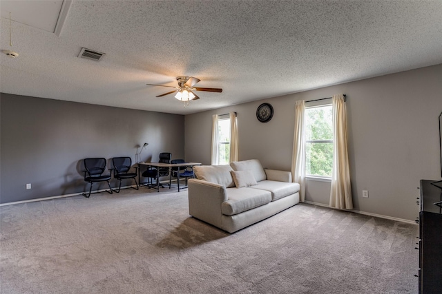1017 Lake Trail Dr, Little Elm, TX 75068 - living area with carpet flooring, a ceiling fan, a textured ceiling, baseboards, and attic access