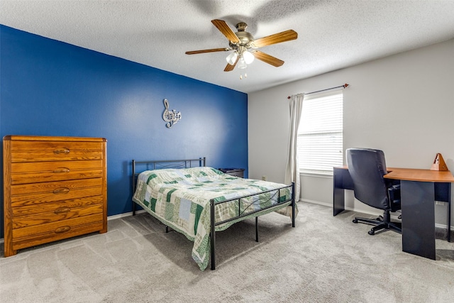 1017 Lake Trail Dr, Little Elm, TX 75068 - bedroom featuring carpet floors, a textured ceiling, a desk, a ceiling fan, and baseboards