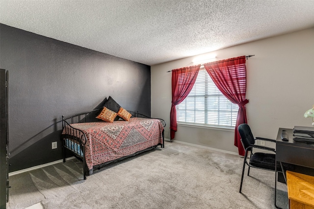 1017 Lake Trail Dr, Little Elm, TX 75068 - carpeted bedroom with a textured ceiling, an office area, baseboards, and a textured wall