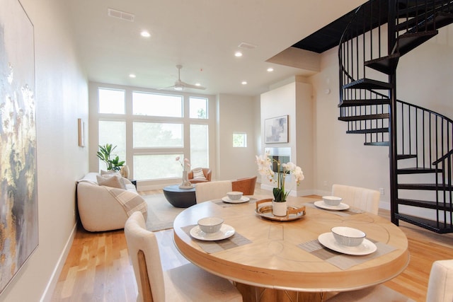 2111 Clark St Unit C, Dallas, TX 75204 - dining room featuring ceiling fan, light wood-type flooring, stairs, recessed lighting, and baseboards