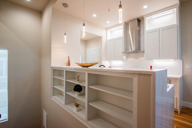 2111 Clark St Unit C, Dallas, TX 75204 - bar featuring wall chimney range hood, wood finished floors, baseboards, decorative light fixtures, and recessed lighting