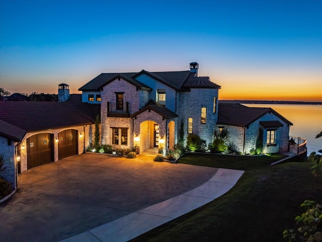 12633 Lakeview Ct, Fort Worth, TX 76179 - view of front facade featuring stone siding, an attached garage, concrete driveway, and a front yard