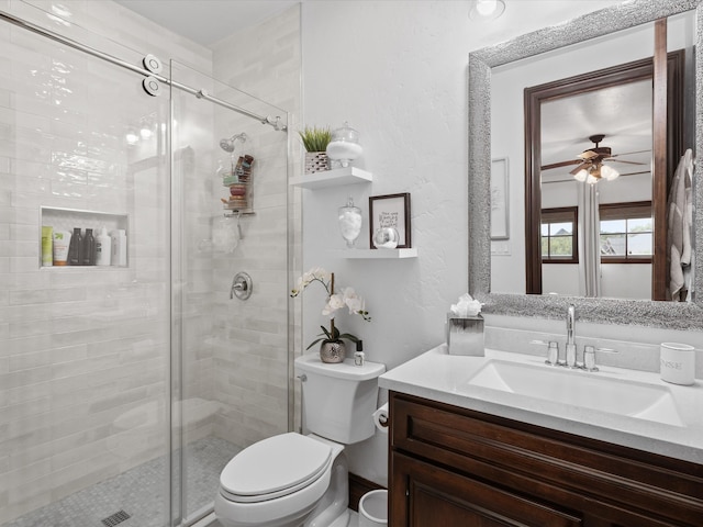 12633 Lakeview Ct, Fort Worth, TX 76179 - bathroom featuring toilet, vanity, a stall shower, and ceiling fan