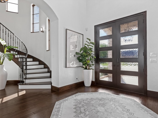12633 Lakeview Ct, Fort Worth, TX 76179 - foyer with arched walkways, hardwood / wood-style floors, french doors, and baseboards