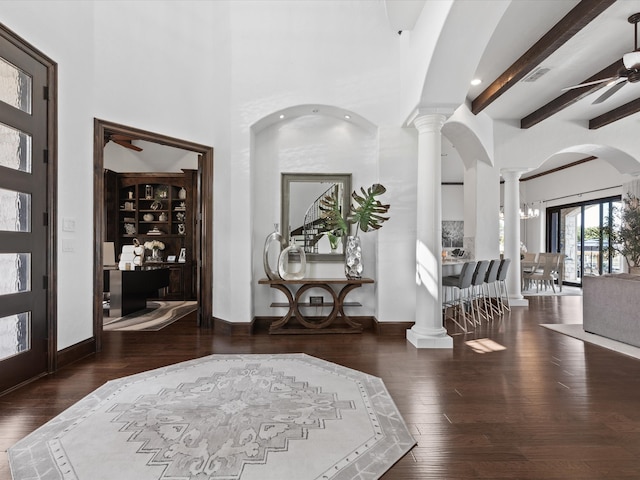 12633 Lakeview Ct, Fort Worth, TX 76179 - entryway featuring ornate columns, a ceiling fan, wood-type flooring, a towering ceiling, and beamed ceiling