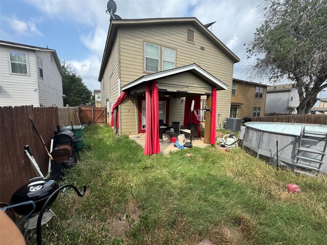 4331 Stetson Run, San Antonio, TX 78223 - back of property featuring a patio area and central air condition unit