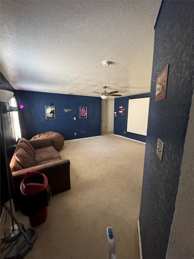4331 Stetson Run, San Antonio, TX 78223 - home theater room featuring ceiling fan, a textured ceiling, a textured wall, and carpet flooring