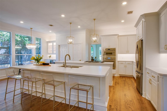 1360 Bent Trail Cir, Southlake, TX 76092 - kitchen with stainless steel appliances, a chandelier, a spacious island, a kitchen bar, and recessed lighting