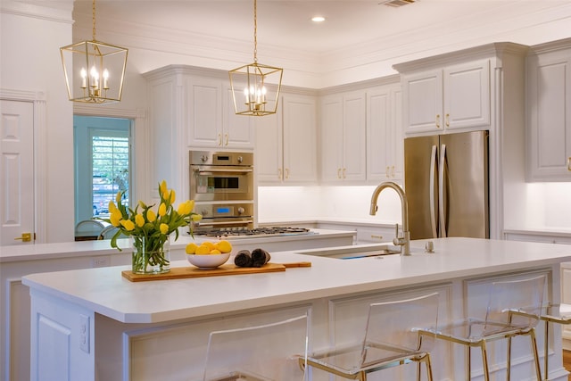 1360 Bent Trail Cir, Southlake, TX 76092 - kitchen with stainless steel appliances, a chandelier, a kitchen island with sink, light countertops, and recessed lighting