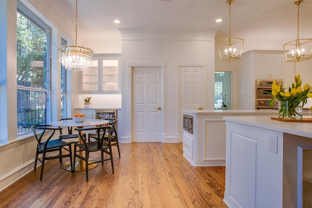 1360 Bent Trail Cir, Southlake, TX 76092 - kitchen featuring a chandelier, appliances with stainless steel finishes, white cabinetry, decorative light fixtures, and ornamental molding