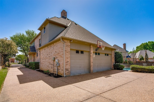1360 Bent Trail Cir, Southlake, TX 76092 - view of side of property with a chimney, roof with shingles, brick siding, and stucco siding