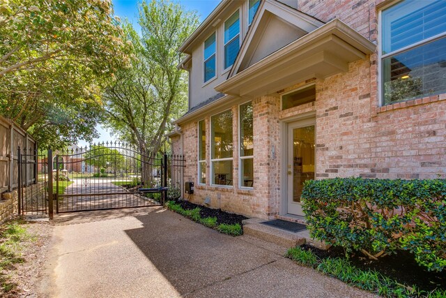 1360 Bent Trail Cir, Southlake, TX 76092 - entrance to property featuring brick siding, a gate, and driveway