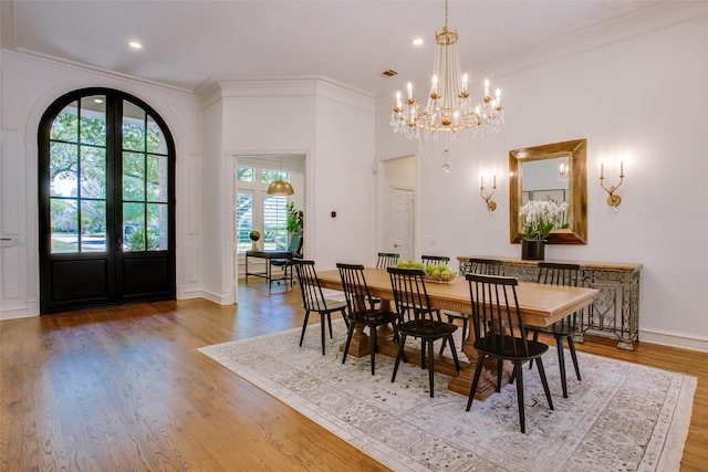 1360 Bent Trail Cir, Southlake, TX 76092 - dining area featuring crown molding, wood finished floors, a chandelier, and recessed lighting