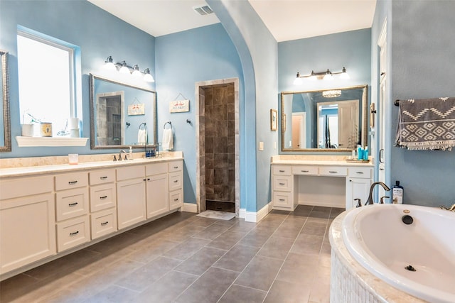 8051 Harliquin Ct, Frisco, TX 75035 - full bath featuring a garden tub, tile patterned floors, vanity, and tiled shower