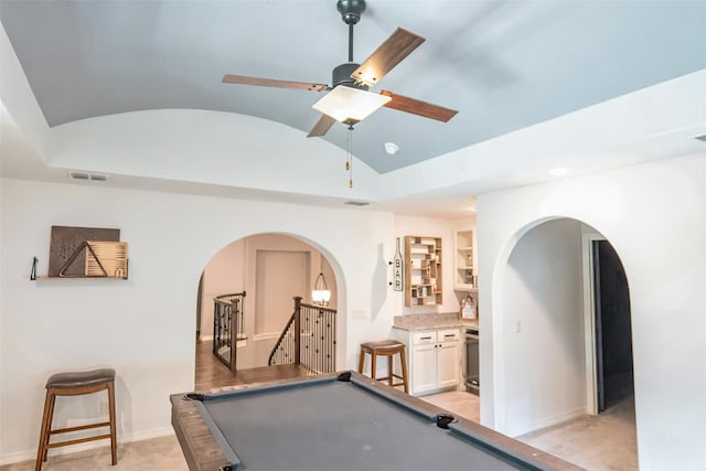 8051 Harliquin Ct, Frisco, TX 75035 - game room featuring arched walkways, lofted ceiling, light carpet, baseboards, and a ceiling fan