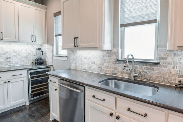 8051 Harliquin Ct, Frisco, TX 75035 - kitchen featuring wine cooler, a sink, stainless steel dishwasher, and dark countertops