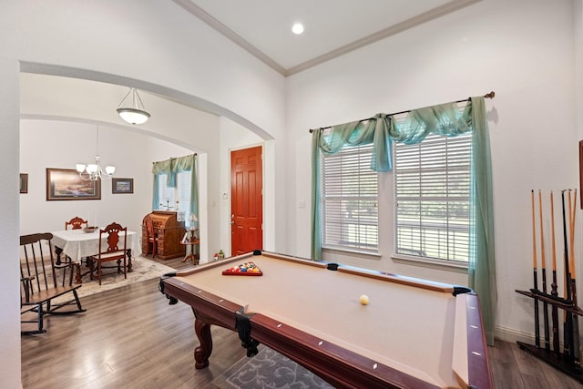 2109 County Road 4522, Justin, TX 76247 - playroom with wood finished floors, billiards table, arched walkways, a chandelier, and ornamental molding