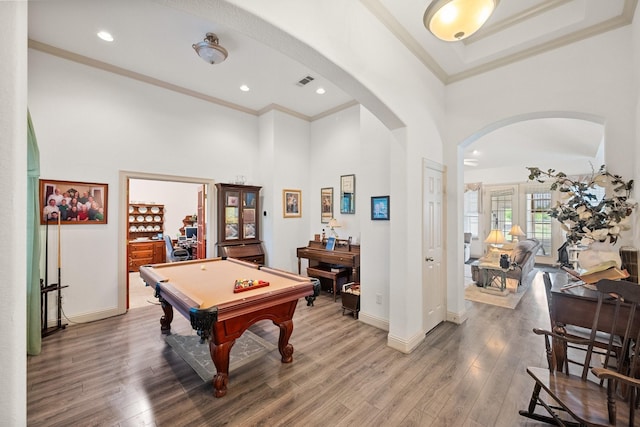 2109 County Road 4522, Justin, TX 76247 - rec room with arched walkways, ornamental molding, a high ceiling, light wood finished floors, and baseboards