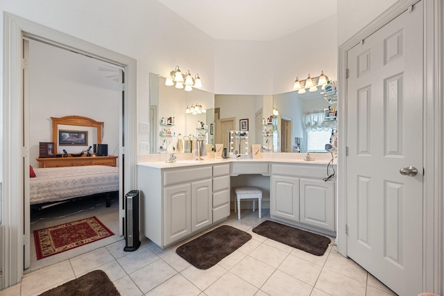 2109 County Road 4522, Justin, TX 76247 - bathroom with ensuite bathroom, double vanity, tile patterned floors, and a chandelier