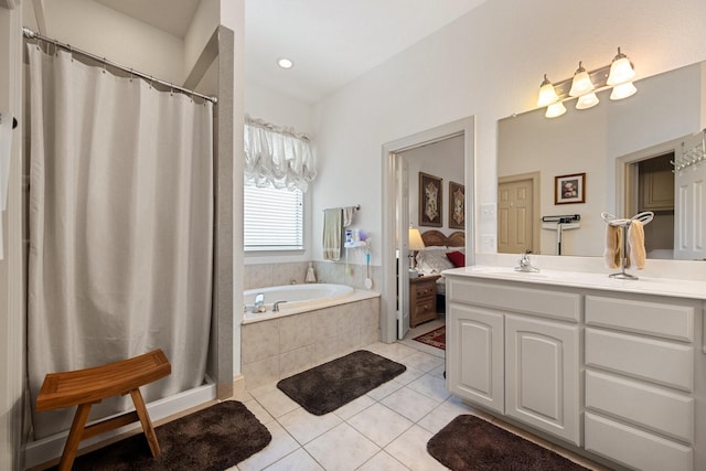 2109 County Road 4522, Justin, TX 76247 - ensuite bathroom featuring tile patterned floors, vanity, a garden tub, and a shower with shower curtain