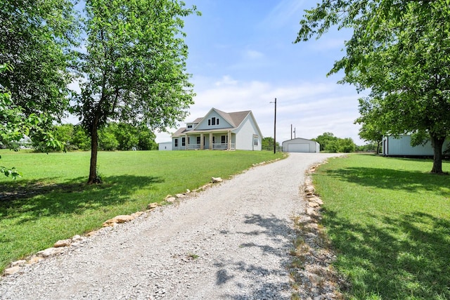 2109 County Road 4522, Justin, TX 76247 - view of front of house with an outdoor structure, a front lawn, and a detached garage