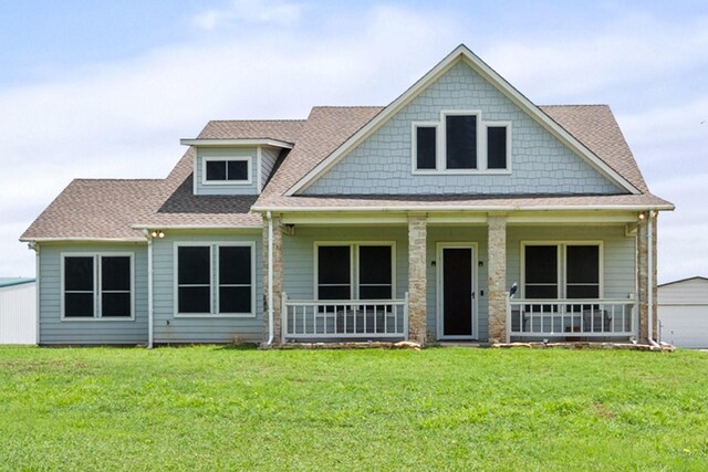 2109 County Road 4522, Justin, TX 76247 - craftsman-style house featuring a porch, a front lawn, and a shingled roof