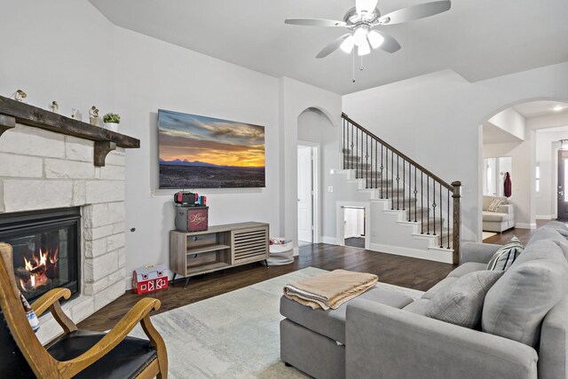 1801 Emerald Vista Blvd, Wylie, TX 75098 - living area featuring arched walkways, wood finished floors, ceiling fan, stairs, and a fireplace