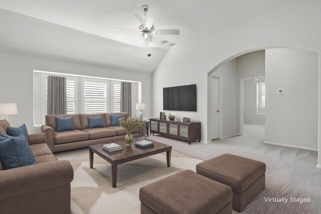 1801 Emerald Vista Blvd, Wylie, TX 75098 - living area featuring arched walkways, a ceiling fan, light colored carpet, baseboards, and high vaulted ceiling