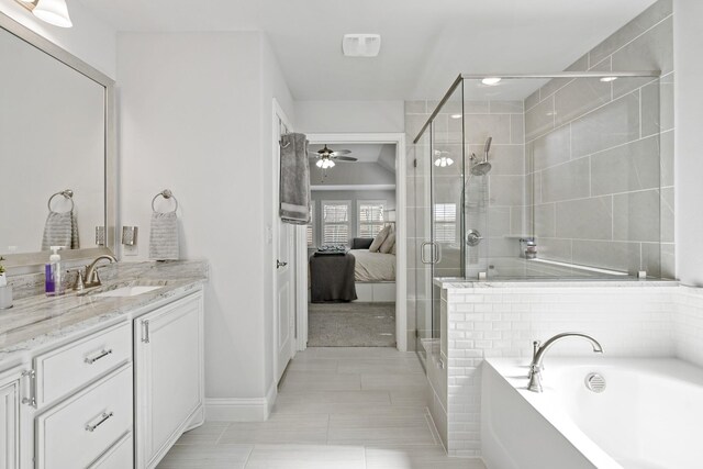 1801 Emerald Vista Blvd, Wylie, TX 75098 - full bathroom with vanity, a garden tub, a shower stall, ensuite bathroom, and ceiling fan