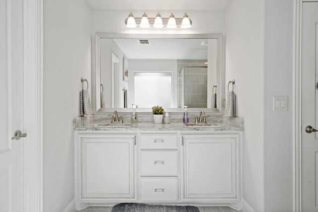 1801 Emerald Vista Blvd, Wylie, TX 75098 - full bathroom featuring double vanity, a tile shower, and baseboards