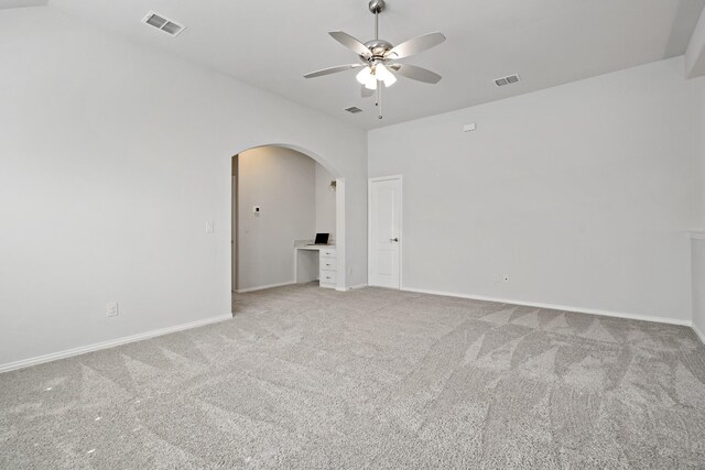 1801 Emerald Vista Blvd, Wylie, TX 75098 - empty room with ceiling fan, light carpet, arched walkways, and baseboards