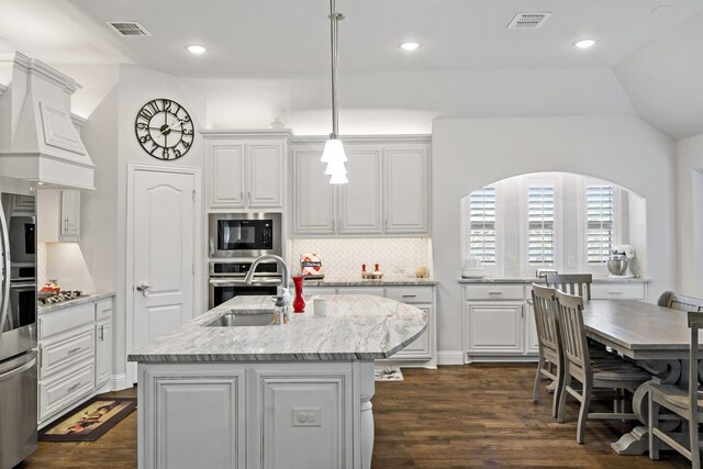 1801 Emerald Vista Blvd, Wylie, TX 75098 - kitchen featuring a sink, appliances with stainless steel finishes, dark wood finished floors, backsplash, and white cabinetry