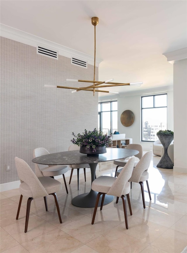 2828 Hood St Unit 1303, Dallas, TX 75219 - dining room featuring a chandelier, baseboards, and ornamental molding