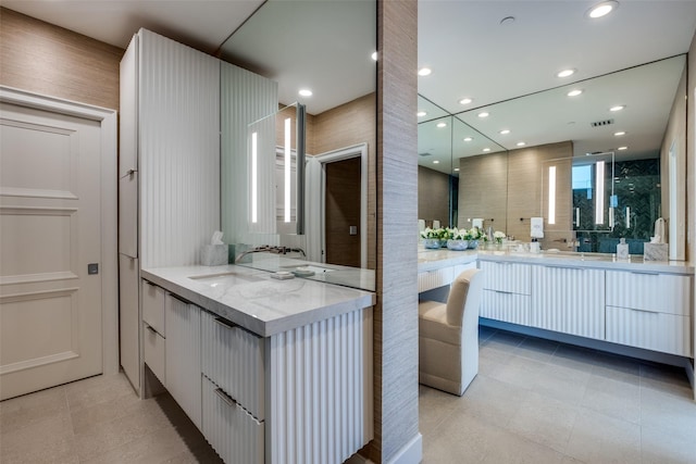 2828 Hood St Unit 1303, Dallas, TX 75219 - bathroom with two vanities, tile patterned flooring, and recessed lighting