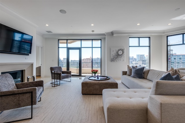 2828 Hood St Unit 1303, Dallas, TX 75219 - living room featuring crown molding, recessed lighting, a fireplace, wood finished floors, and a view of city